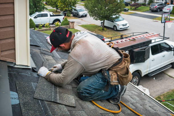 Professional Roofing technician working in Denmark, IA